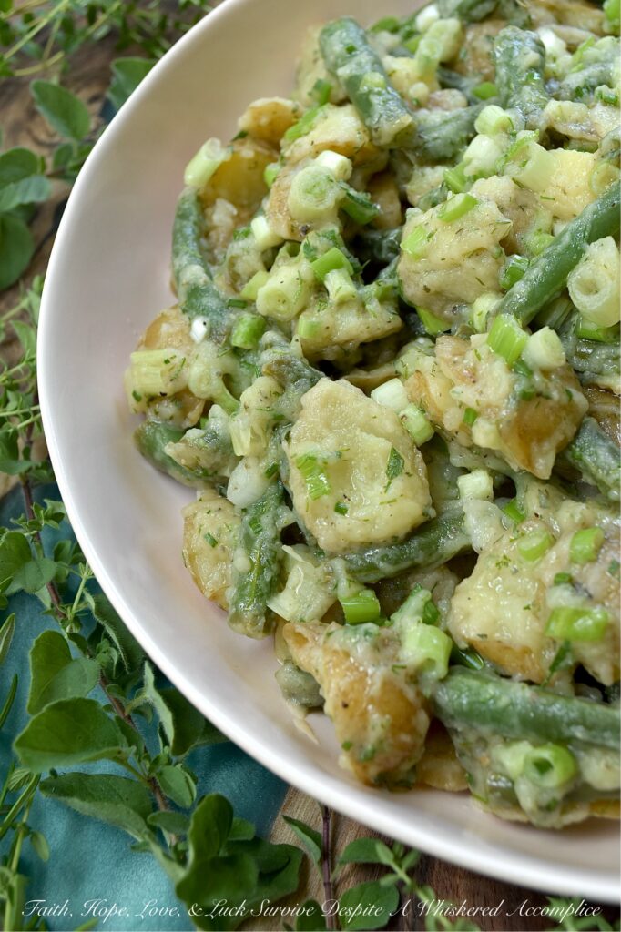 French Green Bean Potato Salad with Fresh Herbs - Featuring buttery-soft baby or little yellow potatoes, the satisfying crunch of fresh green beans, a tangy white wine vinaigrette, and a generous handful of dill, chives, oregano, thyme, and rosemary, this French Green Bean Potato Salad with Fresh Herbs is the perfect summer side dish. Mayonnaise-free, heat-friendly, and bursting with tons of fresh herb flavor, it’s everything a warm-weather side dish should be. Best of all? It can be served chilled or at room temperature. Either way is absolutely delicious.