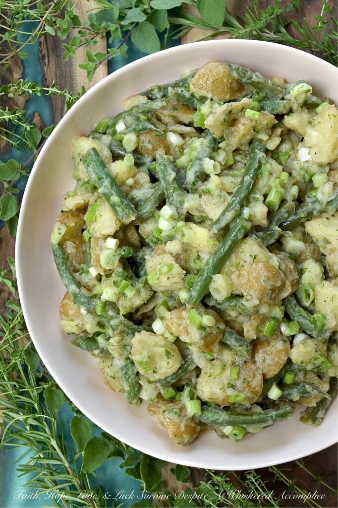 French Green Bean Potato Salad with Fresh Herbs - Featuring buttery-soft baby or little yellow potatoes, the satisfying crunch of fresh green beans, a tangy white wine vinaigrette, and a generous handful of dill, chives, oregano, thyme, and rosemary, this French Green Bean Potato Salad with Fresh Herbs is the perfect summer side dish. Mayonnaise-free, heat-friendly, and bursting with tons of fresh herb flavor, it’s everything a warm-weather side dish should be. Best of all? It can be served chilled or at room temperature. Either way is absolutely delicious.