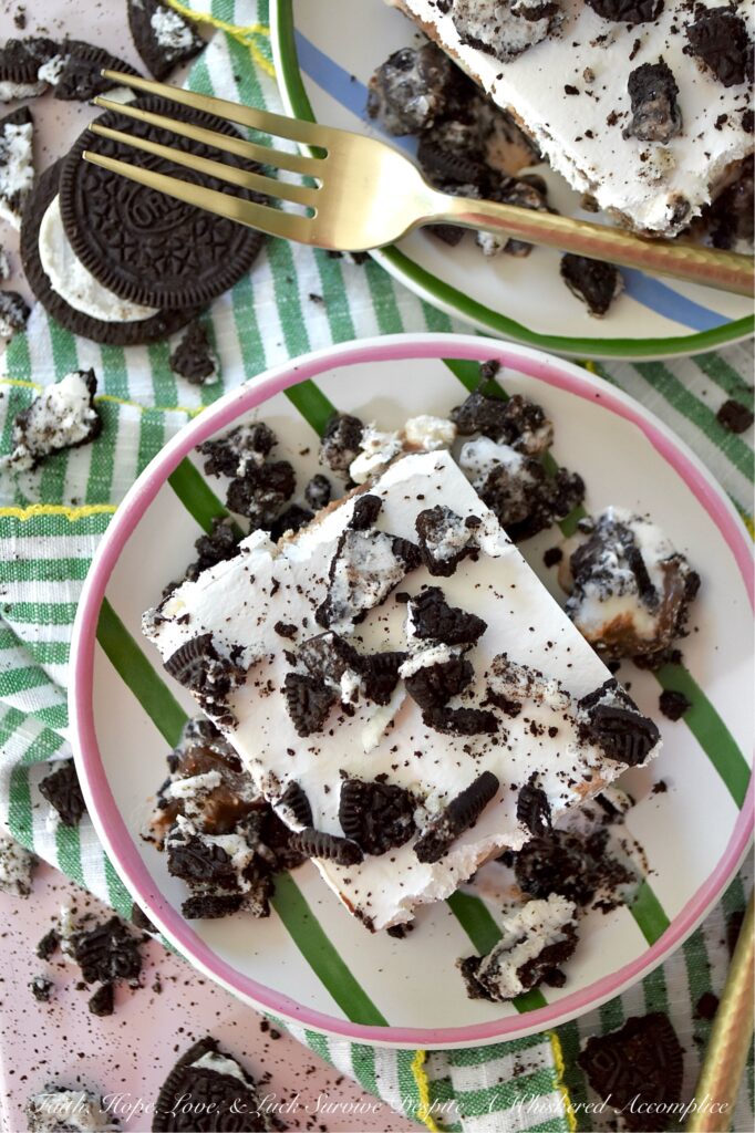 Mom's Famous Ice Cream Mississippi Mud Pie - You know that one famous dessert that Mom always made, the one everyone waited practically all year for? For my family, it was this Mississippi Mud Pie. A layered frozen dessert masterpiece of crushed chocolate sandwich cookies, creamy vanilla ice cream, decadent hot fudge topping, and a crowning layer of fluffy, cloud-like whipped topping. Whether you use a carton or two of store-bought ice cream or churn your own for this recipe, one bite will tell you exactly why this became the legendary treat of our childhood household.