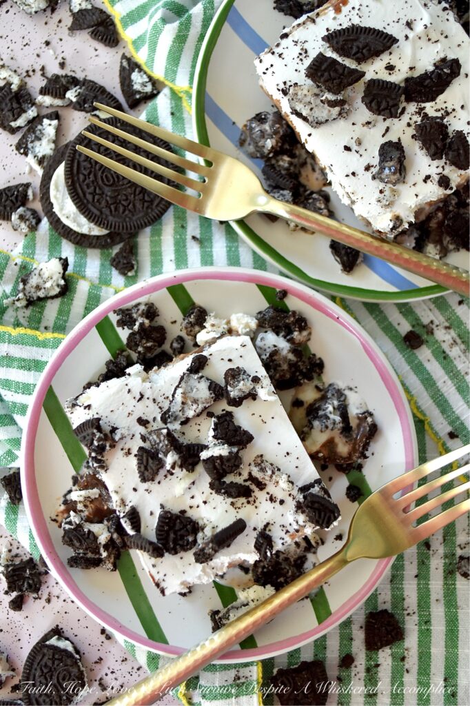 Mom's Famous Ice Cream Mississippi Mud Pie - You know that one famous dessert that Mom always made, the one everyone waited practically all year for? For my family, it was this Mississippi Mud Pie. A layered frozen dessert masterpiece of crushed chocolate sandwich cookies, creamy vanilla ice cream, decadent hot fudge topping, and a crowning layer of fluffy, cloud-like whipped topping. Whether you use a carton or two of store-bought ice cream or churn your own for this recipe, one bite will tell you exactly why this became the legendary treat of our childhood household.