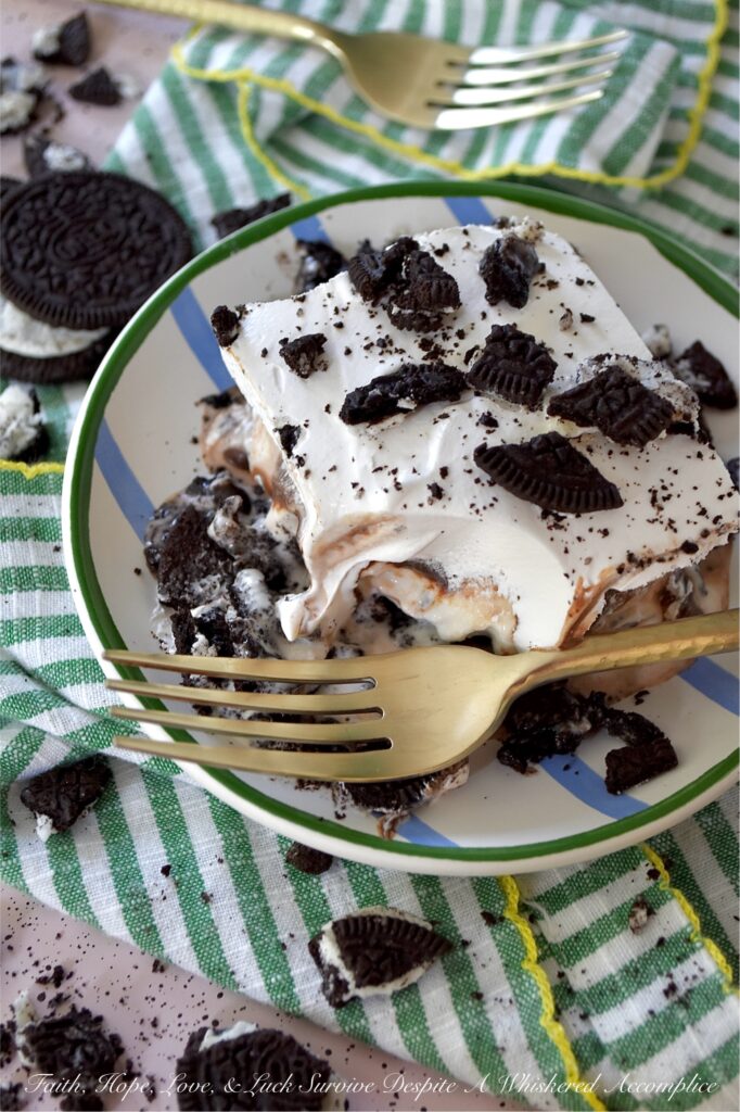 Mom's Famous Ice Cream Mississippi Mud Pie - You know that one famous dessert that Mom always made, the one everyone waited practically all year for? For my family, it was this Mississippi Mud Pie. A layered frozen dessert masterpiece of crushed chocolate sandwich cookies, creamy vanilla ice cream, decadent hot fudge topping, and a crowning layer of fluffy, cloud-like whipped topping. Whether you use a carton or two of store-bought ice cream or churn your own for this recipe, one bite will tell you exactly why this became the legendary treat of our childhood household.