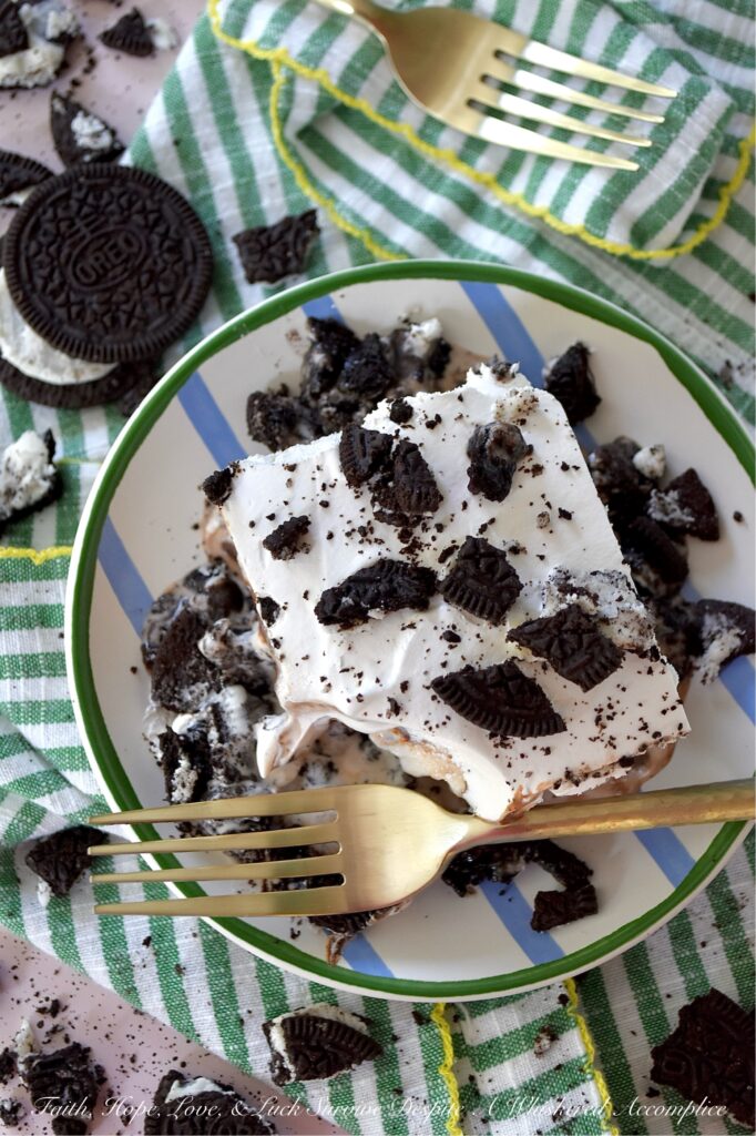 Mom's Famous Ice Cream Mississippi Mud Pie - You know that one famous dessert that Mom always made, the one everyone waited practically all year for? For my family, it was this Mississippi Mud Pie. A layered frozen dessert masterpiece of crushed chocolate sandwich cookies, creamy vanilla ice cream, decadent hot fudge topping, and a crowning layer of fluffy, cloud-like whipped topping. Whether you use a carton or two of store-bought ice cream or churn your own for this recipe, one bite will tell you exactly why this became the legendary treat of our childhood household.