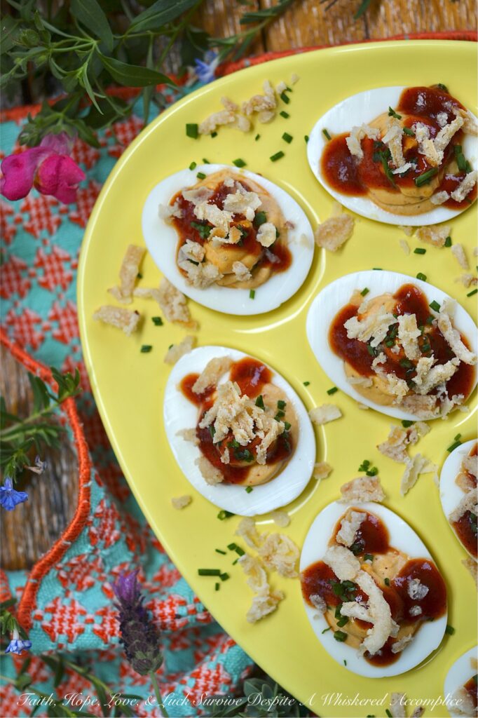 BBQ Deviled Eggs with Crispy Fried Onions - Stop treating crispy fried onions like a holiday guest. Think beyond green bean casserole. With the perfect balance of smoky flavor, creamy filling, and a satisfying, salty crunch in every bite, these BBQ Deviled Eggs topped with fresh chives and crispy fried onions are about to become the star appetizer of your next gathering. Whether you're hosting a game day or looking for the ultimate potluck dish, these bite-sized barbeque-flavored snacks are guaranteed to disappear in minutes.