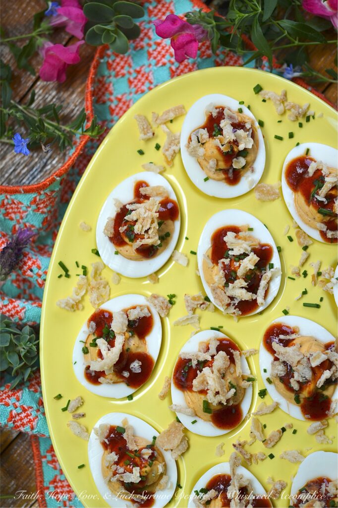 BBQ Deviled Eggs with Crispy Fried Onions - Stop treating crispy fried onions like a holiday guest. Think beyond green bean casserole. With the perfect balance of smoky flavor, creamy filling, and a satisfying, salty crunch in every bite, these BBQ Deviled Eggs topped with fresh chives and crispy fried onions are about to become the star appetizer of your next gathering. Whether you're hosting a game day or looking for the ultimate potluck dish, these bite-sized barbeque-flavored snacks are guaranteed to disappear in minutes.