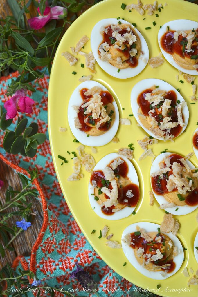 BBQ Deviled Eggs with Crispy Fried Onions - Stop treating crispy fried onions like a holiday guest. Think beyond green bean casserole. With the perfect balance of smoky flavor, creamy filling, and a satisfying, salty crunch in every bite, these BBQ Deviled Eggs topped with fresh chives and crispy fried onions are about to become the star appetizer of your next gathering. Whether you're hosting a game day or looking for the ultimate potluck dish, these bite-sized barbeque-flavored snacks are guaranteed to disappear in minutes.