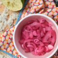 3-Ingredient Lime Juice Pickled Red Onions - With these 3-Ingredient Lime Juice Pickled Red Onions, you're three ingredients away from adding tremendous flavor to almost everything you eat. Whether you're folding these salty, tangy pickled red onions into a pasta or potato salad, layering them on a loaded sandwich, or sneaking them straight from the jar, these almost-effortless, vibrant, perfectly crisp lime juice pickled red onions are about to become your new absolute favorite. And to think, all you need is one red onion, one lime, and a little bit of sea salt.