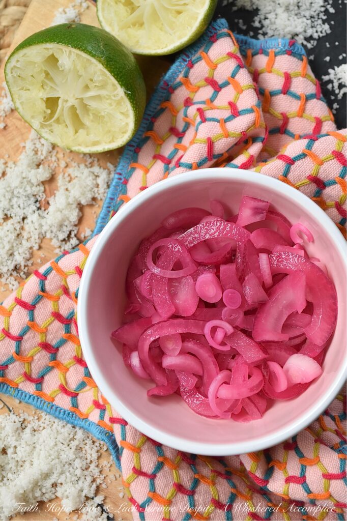 3-Ingredient Lime Juice Pickled Red Onions - With these 3-Ingredient Lime Juice Pickled Red Onions, you're three ingredients away from adding tremendous flavor to almost everything you eat. Whether you're folding these salty, tangy pickled red onions into a pasta or potato salad, layering them on a loaded sandwich, or sneaking them straight from the jar, these almost-effortless, vibrant, perfectly crisp lime juice pickled red onions are about to become your new absolute favorite. And to think, all you need is one red onion, one lime, and a little bit of sea salt.