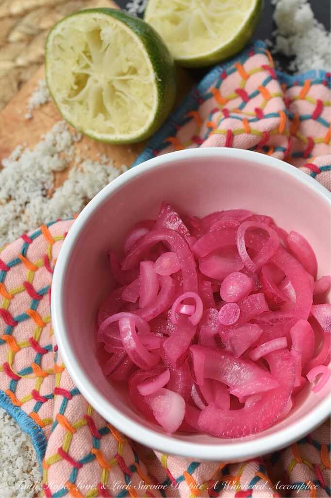 3-Ingredient Lime Juice Pickled Red Onions - With these 3-Ingredient Lime Juice Pickled Red Onions, you're three ingredients away from adding tremendous flavor to almost everything you eat. Whether you're folding these salty, tangy pickled red onions into a pasta or potato salad, layering them on a loaded sandwich, or sneaking them straight from the jar, these almost-effortless, vibrant, perfectly crisp lime juice pickled red onions are about to become your new absolute favorite. And to think, all you need is one red onion, one lime, and a little bit of sea salt.
