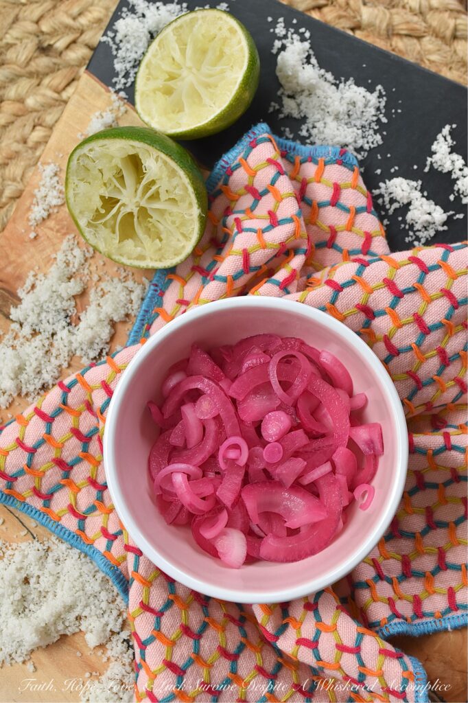 3-Ingredient Lime Juice Pickled Red Onions - With these 3-Ingredient Lime Juice Pickled Red Onions, you're three ingredients away from adding tremendous flavor to almost everything you eat. Whether you're folding these salty, tangy pickled red onions into a pasta or potato salad, layering them on a loaded sandwich, or sneaking them straight from the jar, these almost-effortless, vibrant, perfectly crisp lime juice pickled red onions are about to become your new absolute favorite. And to think, all you need is one red onion, one lime, and a little bit of sea salt.