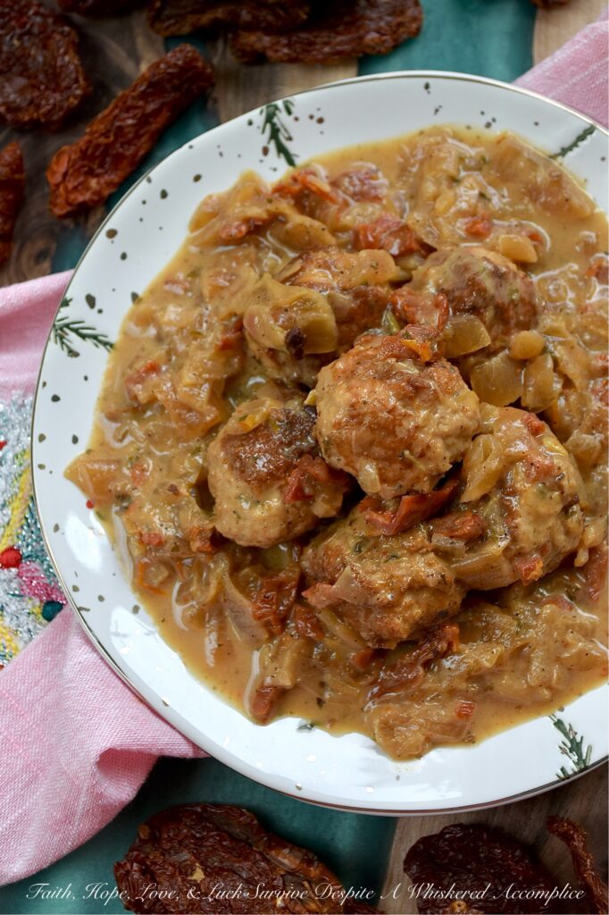 Sun-Dried Tomato Saucy Turkey Meatballs - Tired of the same boring weeknight meal rotation? Break the monotony with these Sun-Dried Tomato Saucy Turkey Meatballs, which can be served over creamy mashed potatoes, piled on top of steamed rice, spooned over your favorite pasta, or stuffed into crusty sub rolls. They come together in one skillet and go with literally everything. Simmered in a luscious cream sauce, flavored with sun-dried tomatoes, lager beer, and Italian seasoning, these meatballs are shockingly soft, incredibly juicy, and dripping with flavor.