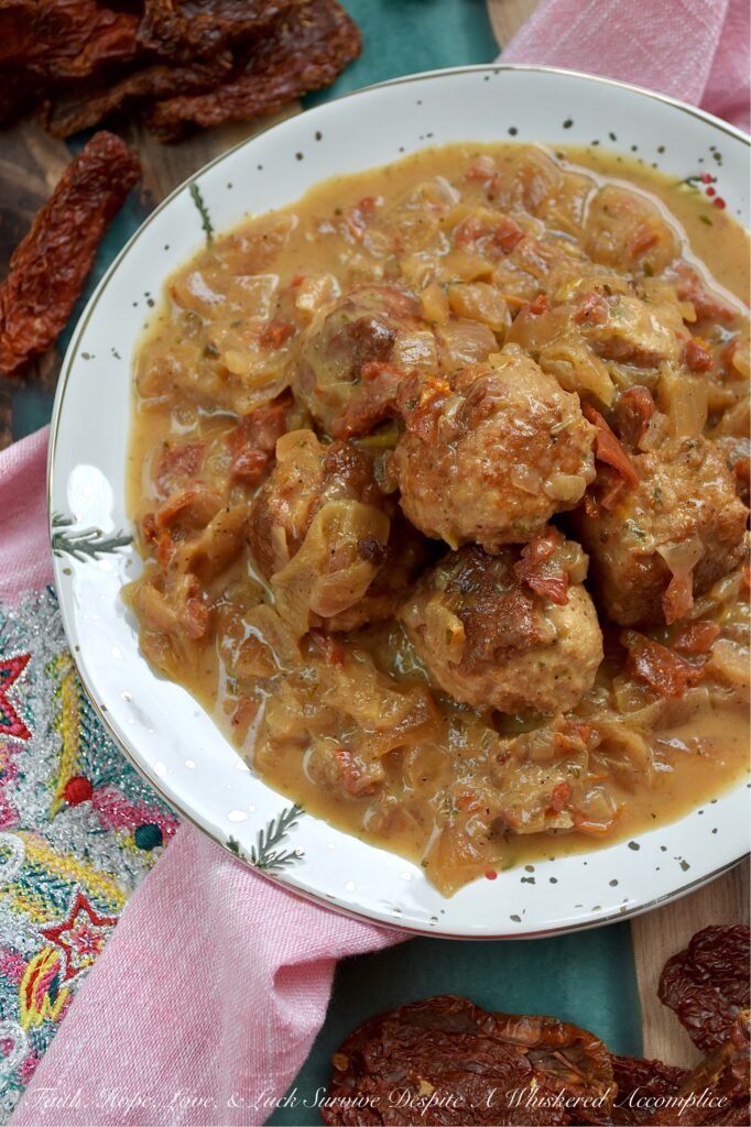 Sun-Dried Tomato Saucy Turkey Meatballs - Tired of the same boring weeknight meal rotation? Break the monotony with these Sun-Dried Tomato Saucy Turkey Meatballs, which can be served over creamy mashed potatoes, piled on top of steamed rice, spooned over your favorite pasta, or stuffed into crusty sub rolls. They come together in one skillet and go with literally everything. Simmered in a luscious cream sauce, flavored with sun-dried tomatoes, lager beer, and Italian seasoning, these meatballs are shockingly soft, incredibly juicy, and dripping with flavor.