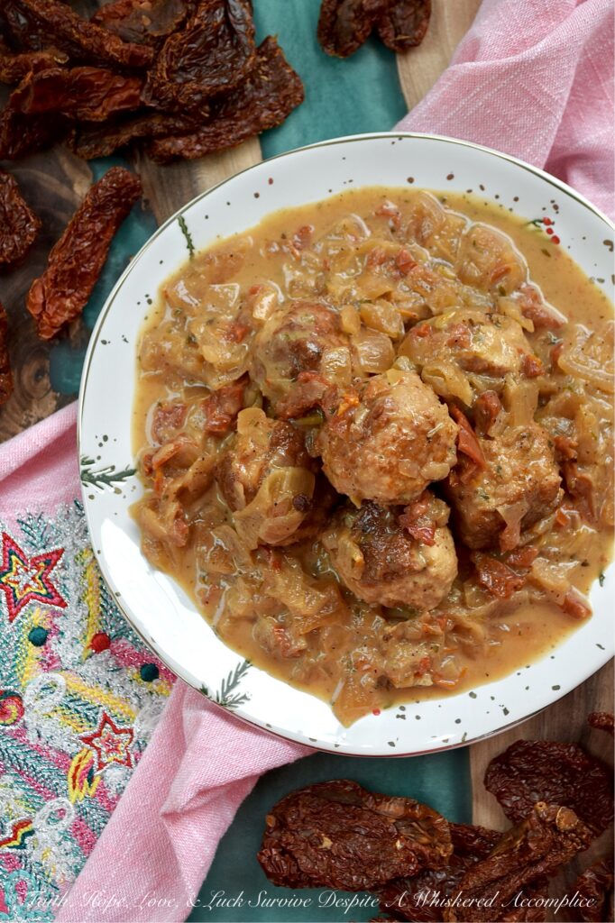 Sun-Dried Tomato Saucy Turkey Meatballs - Tired of the same boring weeknight meal rotation? Break the monotony with these Sun-Dried Tomato Saucy Turkey Meatballs, which can be served over creamy mashed potatoes, piled on top of steamed rice, spooned over your favorite pasta, or stuffed into crusty sub rolls. They come together in one skillet and go with literally everything. Simmered in a luscious cream sauce, flavored with sun-dried tomatoes, lager beer, and Italian seasoning, these meatballs are shockingly soft, incredibly juicy, and dripping with flavor.