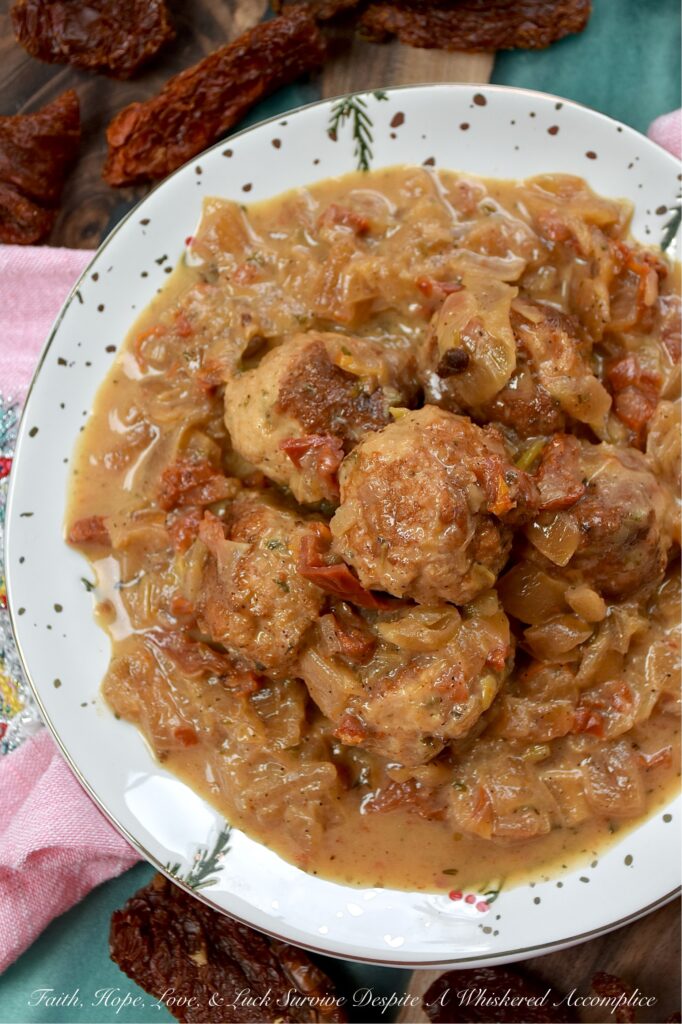 Sun-Dried Tomato Saucy Turkey Meatballs - Tired of the same boring weeknight meal rotation? Break the monotony with these Sun-Dried Tomato Saucy Turkey Meatballs, which can be served over creamy mashed potatoes, piled on top of steamed rice, spooned over your favorite pasta, or stuffed into crusty sub rolls. They come together in one skillet and go with literally everything. Simmered in a luscious cream sauce, flavored with sun-dried tomatoes, lager beer, and Italian seasoning, these meatballs are shockingly soft, incredibly juicy, and dripping with flavor.