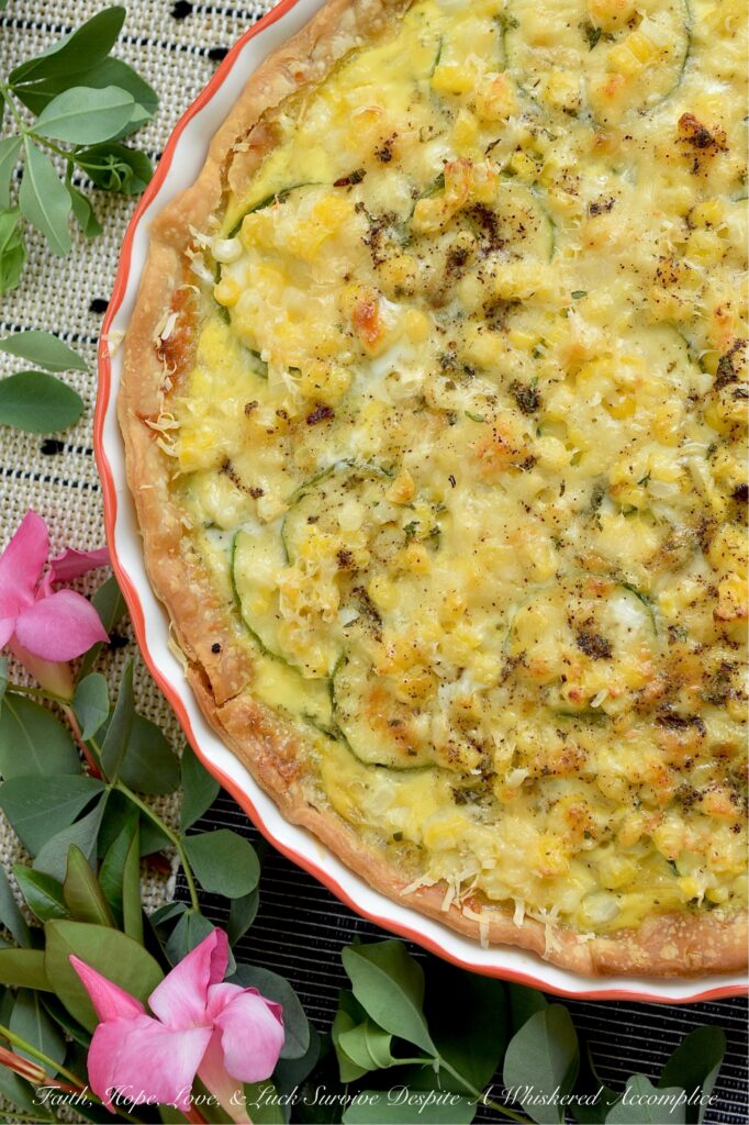 Fresh Summer Corn & Zucchini Sausage Quiche - Bursting with sweet fresh corn cut straight from the cob, thinly sliced zucchini, savory sausage, Italian herb seasoning, and a rich blend of sharp white cheddar and parmesan cheese, this isn’t your average quiche. It’s creamy, it’s hearty, and best of all, the veggies actually keep their fresh, satisfying bite. Whether you’re serving it up for a lazy weekend breakfast, a light brunch or lunch, or an easy weeknight dinner casserole, this is a rich, flavorful slice of summer guaranteed to hit the spot.