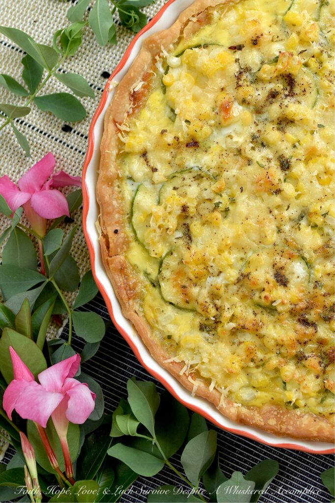 Fresh Summer Corn & Zucchini Sausage Quiche - Bursting with sweet fresh corn cut straight from the cob, thinly sliced zucchini, savory sausage, Italian herb seasoning, and a rich blend of sharp white cheddar and parmesan cheese, this isn’t your average quiche. It’s creamy, it’s hearty, and best of all, the veggies actually keep their fresh, satisfying bite. Whether you’re serving it up for a lazy weekend breakfast, a light brunch or lunch, or an easy weeknight dinner casserole, this is a rich, flavorful slice of summer guaranteed to hit the spot.