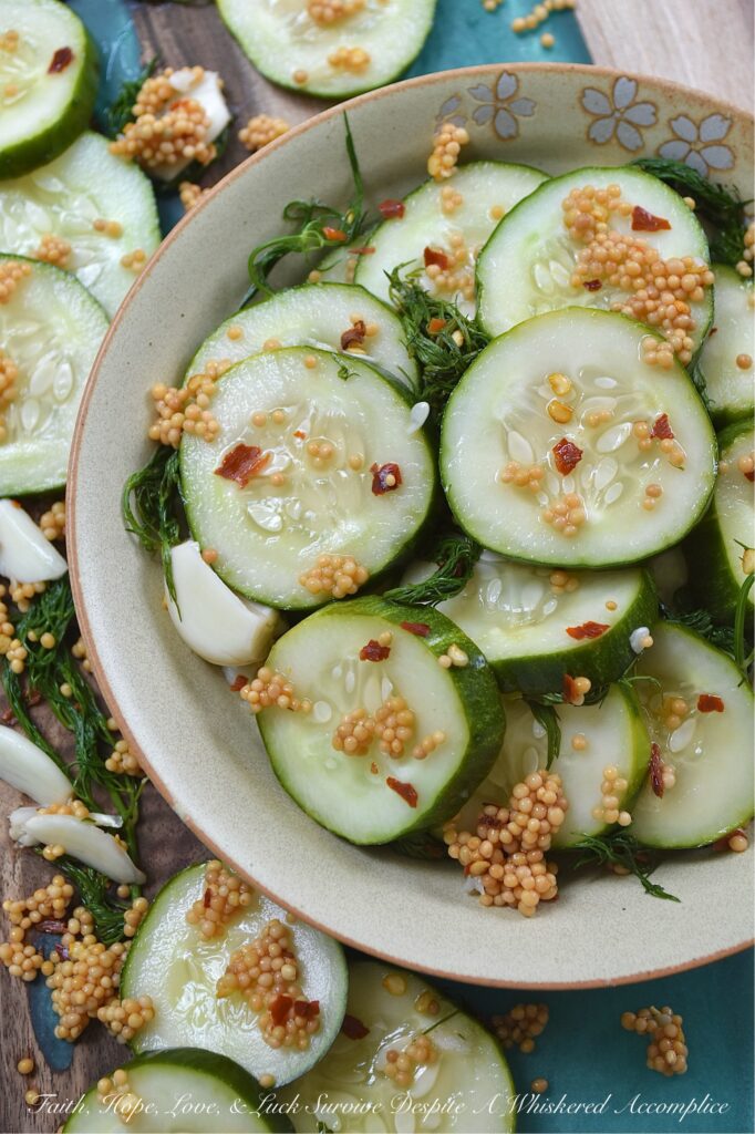 Spicy Quick-Pickled Dill Cucumbers with Garlic - In just a few minutes, you can assemble a spicy jar of garlic and dill quick pickles that taste fresher, crunchier, and infinitely better than anything you'll find sitting on a grocery store shelf. Just layer, cover with brine, shake, and let the fridge work its magic for a few hours. These spicy quick-pickled dill cucumbers with garlic will stay fresh for up to a week in the fridge, that is, assuming they even make it past day one. No fancy canning equipment and no melting over a hot stove in the middle of summer.