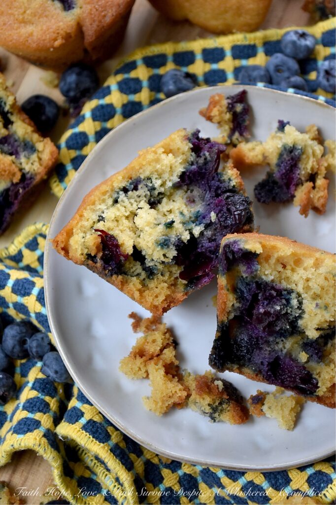 Cornmeal Muffins with Fresh Blueberries - Bursting with fresh, juicy blueberries, these simple, rustic blueberry muffins are incredibly moist, with a tender, soft crumb that is perfectly balanced by the light crunch and subtle sweetness of cornmeal. Whether you’re pairing them with a savory quiche for a lazy weekend brunch, serving them alongside a warm bowl of soup on a chilly evening, or just grabbing one to go with a cup of coffee on a busy weekday morning, they hit the spot every single time.