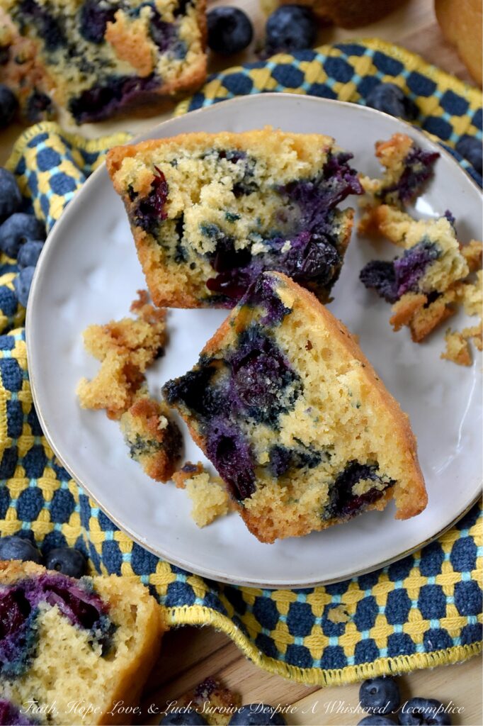 Cornmeal Muffins with Fresh Blueberries - Bursting with fresh, juicy blueberries, these simple, rustic blueberry muffins are incredibly moist, with a tender, soft crumb that is perfectly balanced by the light crunch and subtle sweetness of cornmeal. Whether you’re pairing them with a savory quiche for a lazy weekend brunch, serving them alongside a warm bowl of soup on a chilly evening, or just grabbing one to go with a cup of coffee on a busy weekday morning, they hit the spot every single time.