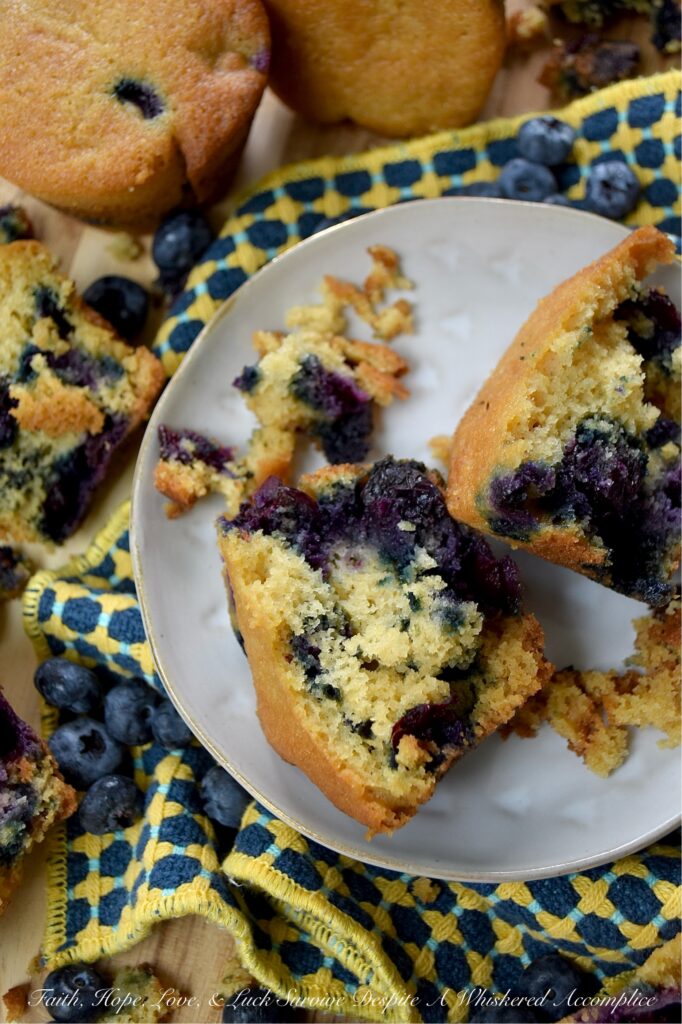 Cornmeal Muffins with Fresh Blueberries - Bursting with fresh, juicy blueberries, these simple, rustic blueberry muffins are incredibly moist, with a tender, soft crumb that is perfectly balanced by the light crunch and subtle sweetness of cornmeal. Whether you’re pairing them with a savory quiche for a lazy weekend brunch, serving them alongside a warm bowl of soup on a chilly evening, or just grabbing one to go with a cup of coffee on a busy weekday morning, they hit the spot every single time.