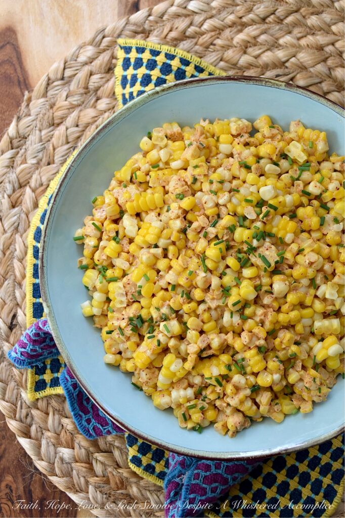 Smoky Southwestern Corn Salad with Chives - This fresh corn salad features a perfectly balanced homemade southwestern seasoning blend made with smoked paprika and warm coriander to bring lots of lovely smoky flavor without adding too much heat. When combined with just a little bit of mayonnaise, a hint of heavy cream, and a splash of vinegar, this seasoning blend creates a slightly sweet, smoky, tangy sauce that's effortlessly delicious. And with its colorful green pop of fresh chives, this flavorful side dish hits pretty much every flavor note without feeling too heavy.