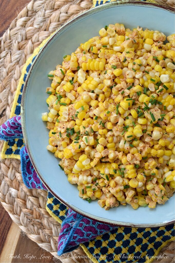 Smoky Southwestern Corn Salad with Chives - This fresh corn salad features a perfectly balanced homemade southwestern seasoning blend made with smoked paprika and warm coriander to bring lots of lovely smoky flavor without adding too much heat. When combined with just a little bit of mayonnaise, a hint of heavy cream, and a splash of vinegar, this seasoning blend creates a slightly sweet, smoky, tangy sauce that's effortlessly delicious. And with its colorful green pop of fresh chives, this flavorful side dish hits pretty much every flavor note without feeling too heavy.