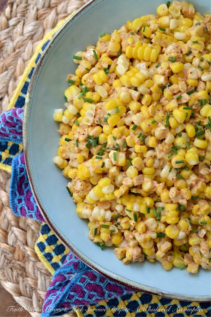 Smoky Southwestern Corn Salad with Chives - This fresh corn salad features a perfectly balanced homemade southwestern seasoning blend made with smoked paprika and warm coriander to bring lots of lovely smoky flavor without adding too much heat. When combined with just a little bit of mayonnaise, a hint of heavy cream, and a splash of vinegar, this seasoning blend creates a slightly sweet, smoky, tangy sauce that's effortlessly delicious. And with its colorful green pop of fresh chives, this flavorful side dish hits pretty much every flavor note without feeling too heavy.