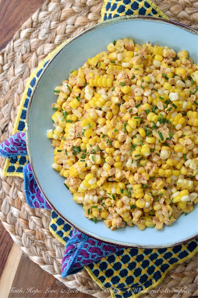 Smoky Southwestern Corn Salad with Chives - This fresh corn salad features a perfectly balanced homemade southwestern seasoning blend made with smoked paprika and warm coriander to bring lots of lovely smoky flavor without adding too much heat. When combined with just a little bit of mayonnaise, a hint of heavy cream, and a splash of vinegar, this seasoning blend creates a slightly sweet, smoky, tangy sauce that's effortlessly delicious. And with its colorful green pop of fresh chives, this flavorful side dish hits pretty much every flavor note without feeling too heavy.