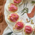 Pickled Red Onion Southwestern Deviled Eggs - These Southwest-inspired deviled eggs are ultra-creamy, perfectly tangy, and loaded with a savory, custom-blended Smoky Southwestern Seasoning that doesn't rely on heat to deliver massive flavor. Finished with a sprinkle of extra seasoning and vibrant, ridiculously easy-to-make lime juice-pickled red onions for the ultimate zesty crunch, this unforgettable deviled egg recipe is guaranteed to be a hit at your next backyard barbecue, game day, or family gathering.