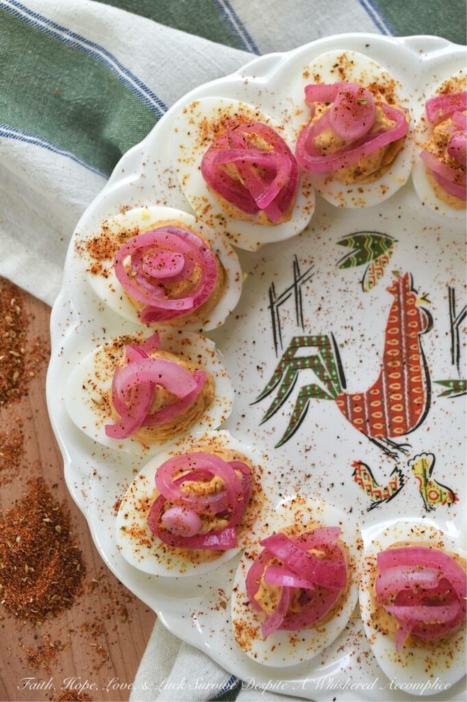Pickled Red Onion Southwestern Deviled Eggs - These Southwest-inspired deviled eggs are ultra-creamy, perfectly tangy, and loaded with a savory, custom-blended Smoky Southwestern Seasoning that doesn't rely on heat to deliver massive flavor. Finished with a sprinkle of extra seasoning and vibrant, ridiculously easy-to-make lime juice-pickled red onions for the ultimate zesty crunch, this unforgettable deviled egg recipe is guaranteed to be a hit at your next backyard barbecue, game day, or family gathering.
