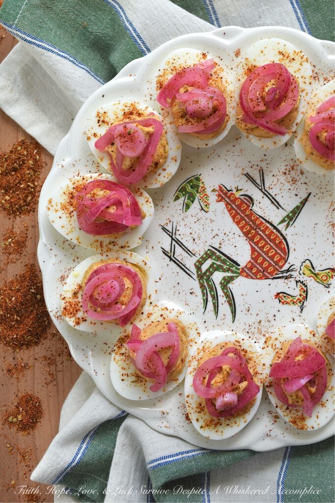 Pickled Red Onion Southwestern Deviled Eggs - These Southwest-inspired deviled eggs are ultra-creamy, perfectly tangy, and loaded with a savory, custom-blended Smoky Southwestern Seasoning that doesn't rely on heat to deliver massive flavor. Finished with a sprinkle of extra seasoning and vibrant, ridiculously easy-to-make lime juice-pickled red onions for the ultimate zesty crunch, this unforgettable deviled egg recipe is guaranteed to be a hit at your next backyard barbecue, game day, or family gathering.