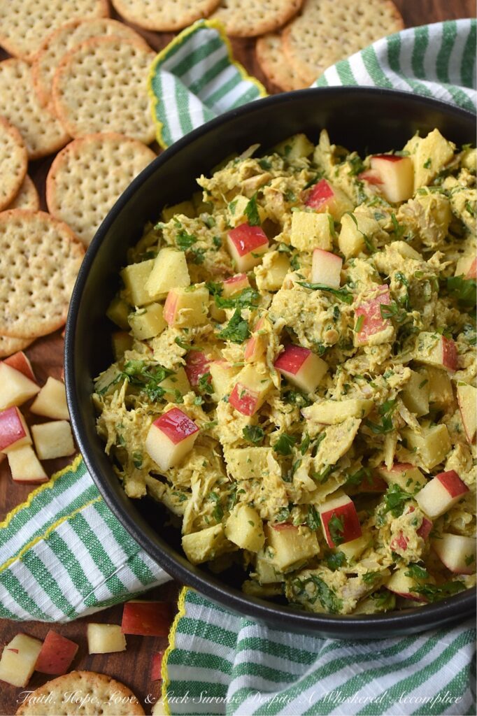 Mild Curry Chicken Salad with Diced Red Apples - This mild curry chicken salad features tender shredded rotisserie chicken tossed in a creamy, golden dressing that brings all the aromatic warmth of curry without the fiery heat. Paired with the sweet, crunchy snap of diced red apples, it's a light, flavorful chicken salad perfect for serving on crispy wheat crackers or for making sandwiches. Whether you stir in a handful of fresh cilantro for an herbal pop of bright color or opt for scallions, parsley, celery, or onion instead, this chicken salad is sure to be an instant favorite.