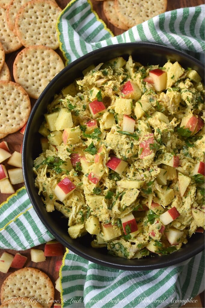 Mild Curry Chicken Salad with Diced Red Apples - This mild curry chicken salad features tender shredded rotisserie chicken tossed in a creamy, golden dressing that brings all the aromatic warmth of curry without the fiery heat. Paired with the sweet, crunchy snap of diced red apples, it's a light, flavorful chicken salad perfect for serving on crispy wheat crackers or for making sandwiches. Whether you stir in a handful of fresh cilantro for an herbal pop of bright color or opt for scallions, parsley, celery, or onion instead, this chicken salad is sure to be an instant favorite.