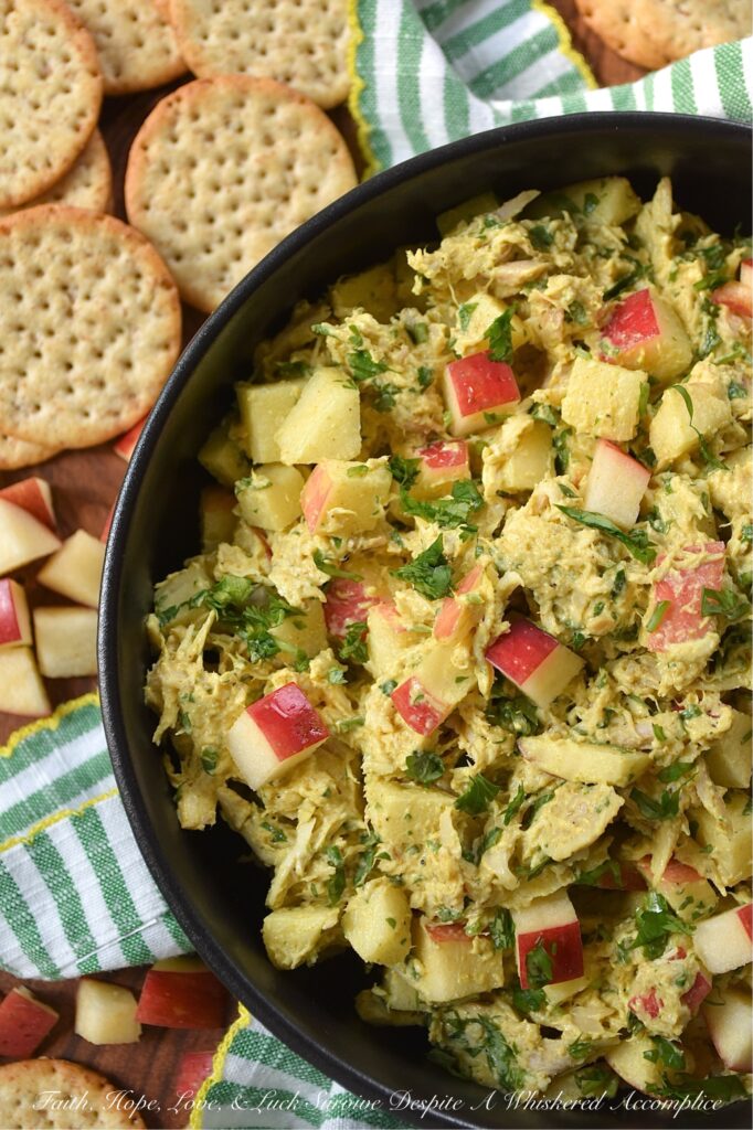 Mild Curry Chicken Salad with Diced Red Apples - This mild curry chicken salad features tender shredded rotisserie chicken tossed in a creamy, golden dressing that brings all the aromatic warmth of curry without the fiery heat. Paired with the sweet, crunchy snap of diced red apples, it's a light, flavorful chicken salad perfect for serving on crispy wheat crackers or for making sandwiches. Whether you stir in a handful of fresh cilantro for an herbal pop of bright color or opt for scallions, parsley, celery, or onion instead, this chicken salad is sure to be an instant favorite.