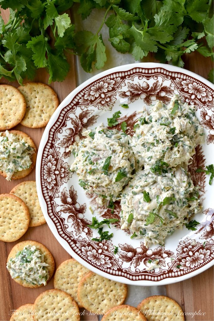 Sweet & Spicy Cilantro Rotisserie Chicken Salad - If you’re one of those folks who runs screaming at the mere mention of cilantro, you might want to skip this recipe. This sweet, spicy rotisserie chicken salad packs a serious flavor punch with fresh cilantro and the addictive sweet heat of candied jalapeños. But here's the best part. Since it uses only half of a rotisserie chicken, leaving the other half for another recipe, along with the skin and bones to make homemade broth for a future soup, it’s basically three recipes for the price of one. That’s what we call a triple win. So, if your lunch routine has been feeling a little dull lately, this shredded chicken salad is here to shake things up in the best way possible.