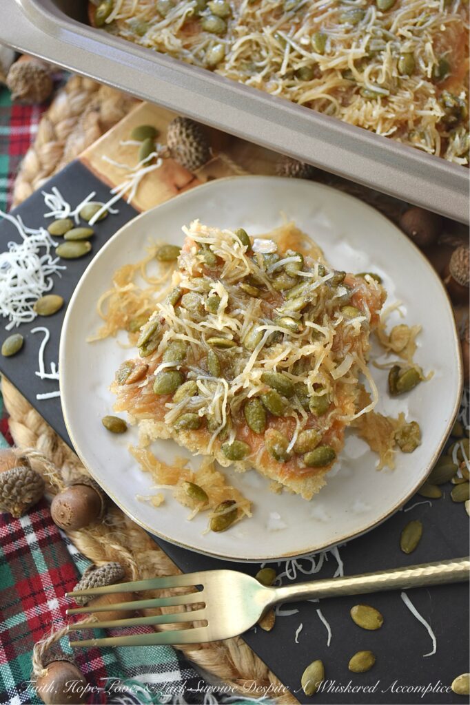 Fall Pear Ugly Duckling Cake (Cake Mix Recipe) - Don’t let the quirky name fool you. This simple, fall-inspired rustic “ugly duckling cake” bakes up into a sweet, buttery, incredibly moist, unforgettable cake. Infused with cozy fall flavors like pear and warm cinnamon, plus a delightful crunch from unsweetened shredded coconut and roasted salted pepitas or pumpkin seeds, this amped-up cake mix recipe is about to become your new favorite autumn obsession. Who knew a can of pears and a box of store-bought cake mix could become something almost magical?