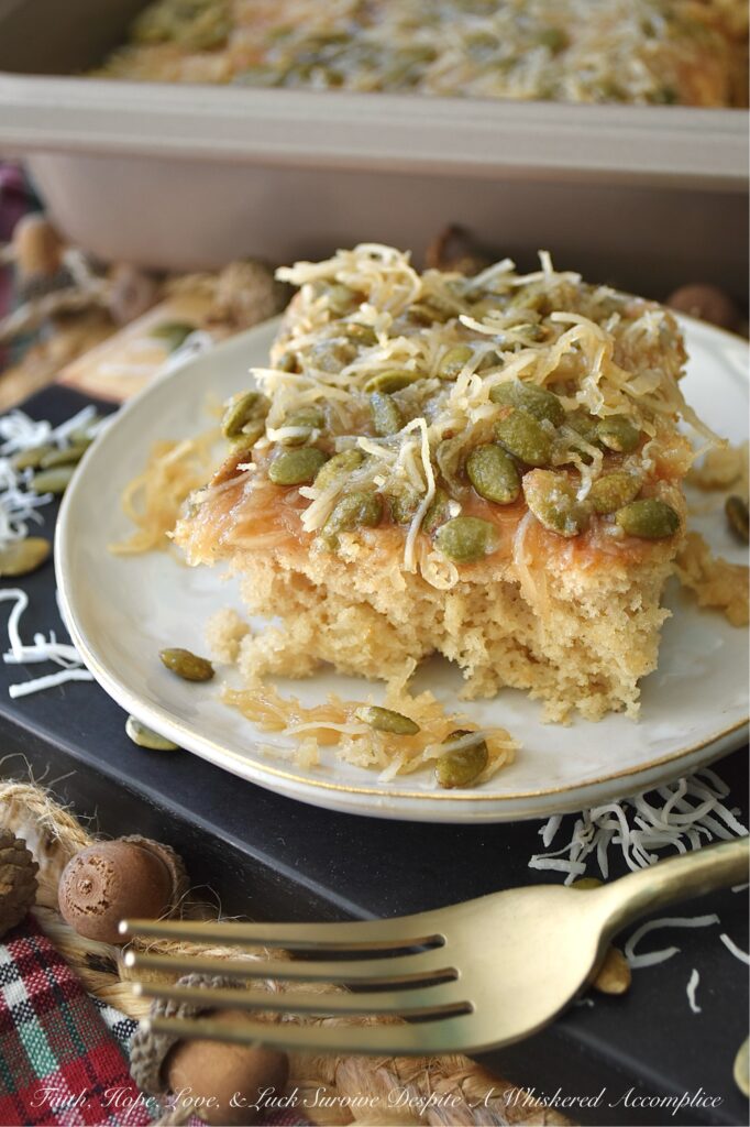 Fall Pear Ugly Duckling Cake (Cake Mix Recipe) - Don’t let the quirky name fool you. This simple, fall-inspired rustic “ugly duckling cake” bakes up into a sweet, buttery, incredibly moist, unforgettable cake. Infused with cozy fall flavors like pear and warm cinnamon, plus a delightful crunch from unsweetened shredded coconut and roasted salted pepitas or pumpkin seeds, this amped-up cake mix recipe is about to become your new favorite autumn obsession. Who knew a can of pears and a box of store-bought cake mix could become something almost magical?