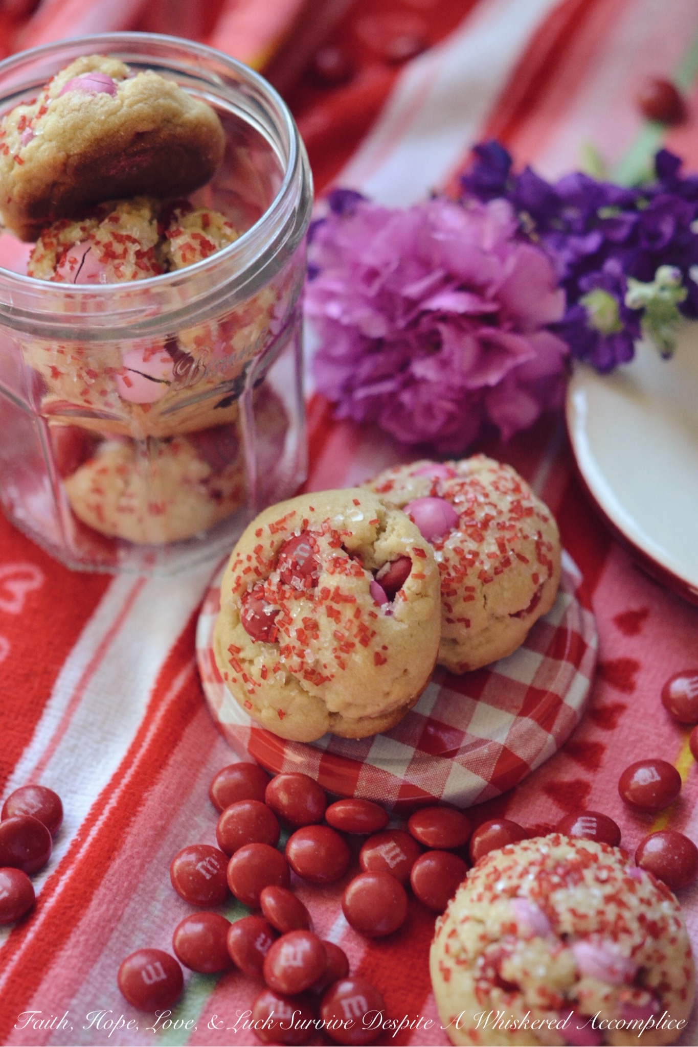 Valentine's Tea Cookies - Celebrate Valentine's Day with these Valentine's Tea Cookies, which are filled with a healthy dose of Milk Chocolate M&M's and generously sprinkled with red and white sanding sugar.