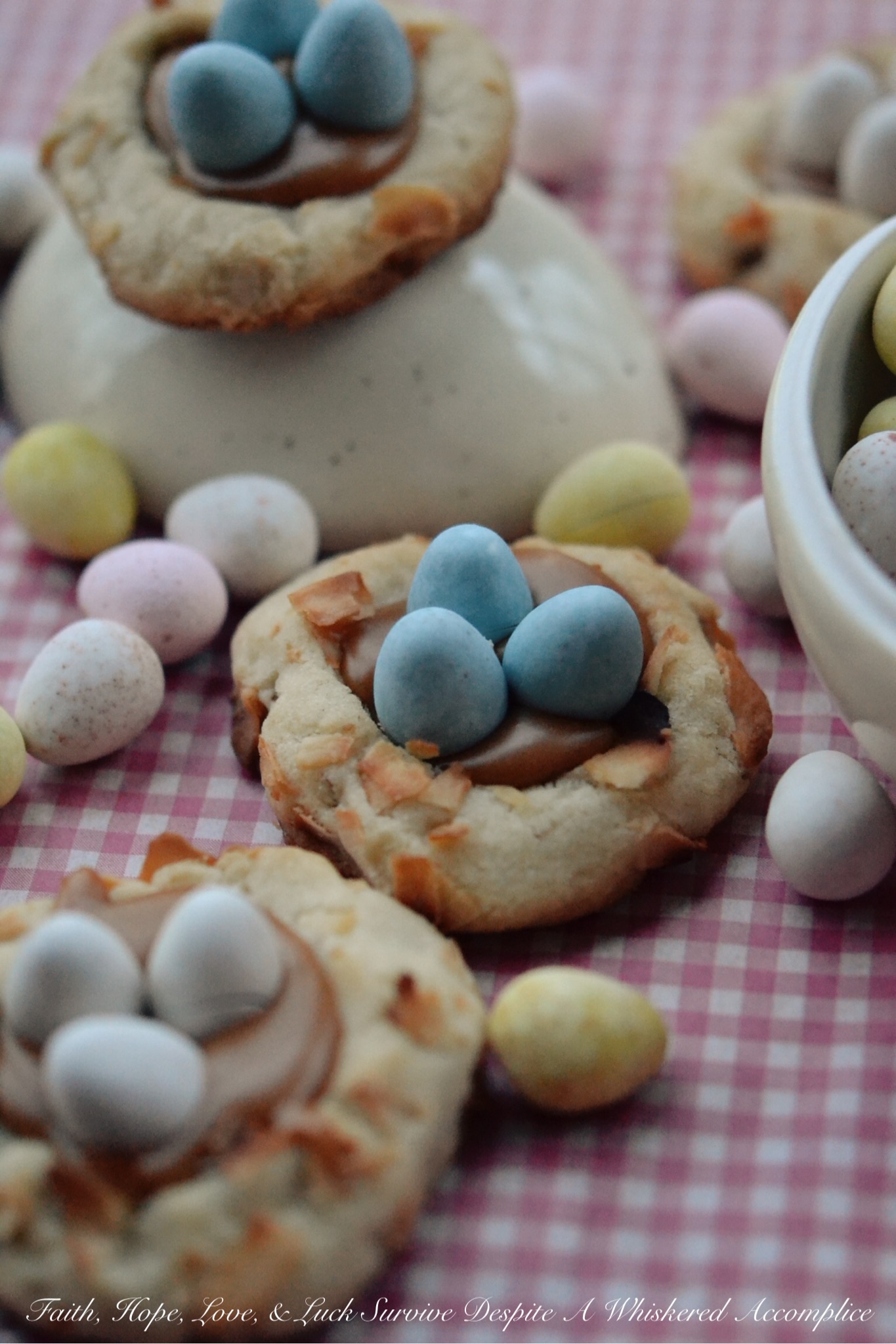 Pretzel Birds Nest Cookies - These charming little spring cookies get their nest-like appearance thanks to crushed pretzels and flaked coconut. After being filled with melted caramel and then topped with a few chocolate candy eggs, these sweet, heavenly thumbprint cookies are ready for some serious Easter munching.