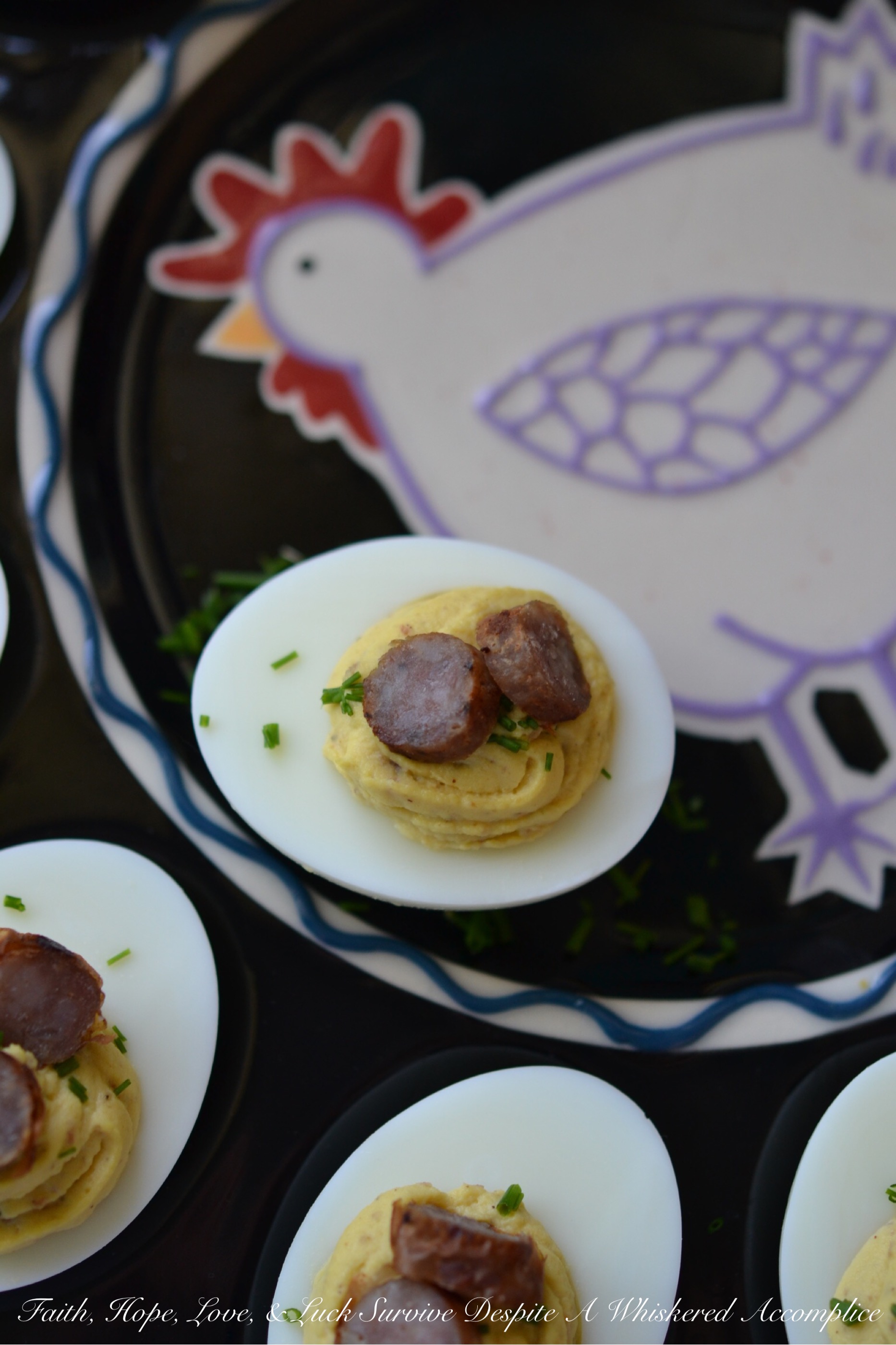 Maple Sausage Breakfast Deviled Eggs - Imagine the creamy, tangy goodness of a classic deviled egg infused with the irresistible taste of maple sausage. Perfectly seasoned with mayonnaise, mustard, black pepper, and a touch of real maple syrup, these utterly delicious deviled eggs are garnished with a festive and flavorful sprinkle of fresh chives as well as a few slices of maple sausage. Whether you're looking for a unique appetizer or a fun addition to your next brunch spread, these delightful breakfast-worthy deviled eggs are guaranteed to be a conversation starter.