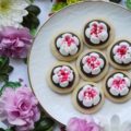 Chocolate Covered Russian Rose Shortbread - These gorgeous shortbread cookies are covered with melted dark chocolate and then decorated with beautiful handmade royal icing flowers, made using a Russian piping tip. For an easier-to-make version, you can forgo the royal icing flowers and decorate these miniature shortbread cookies with sprinkles, candy hearts, or any festive holiday candies.