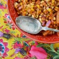 Roasted Corn Salad with Chile Vinaigrette - The perfect picnic or cookout side dish is one that is not only super flavorful but one that can hold its own against high summer temperatures. This incredible summer roasted corn salad has just the right amount of smokey chile flavor with just a touch of sweetness to help balance everything out and is also safe to serve on even the hottest summer day.