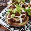Secret Ingredient Beef Nacho Potato Skins - There's a secret ingredient used in these potato skins which helps make them taste absolutely amazing. Can you guess what it is? Chocolate. Adding a little bit of bittersweet baking chocolate to the nacho beef mixture stuffed inside of these oven-baked potato skins truly does make all the difference. Don't believe me? Give them a try and see for yourself.