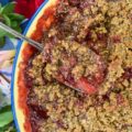 Strawberry Crisp with Pepita & Chia Seed Topping - It's often hard to achieve a truly crispy topping when baking a strawberry crisp if you aren't using nuts in the topping. This sweet summer strawberry crisp uses pepita and chia seeds to create the perfect crispy topping, for those who are allergic to nuts, who still crave a delicious crispy crunchy baked summer berry dessert.