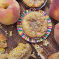Peach Cobbler Muffins with Cinnamon Streusel - Can a muffin make you fall instantly in love? These peach cobbler muffins certainly can. Not only are they filled with fresh summer peaches, but they're also topped with them as well, making them super-moist, fluffy, and almost sinful. And, since they are also topped with a cinnamon streusel topping, you're pretty much guaranteed to fall head-over-heels in love at first bite.