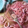 Lime & Beer Pickled Red Onions - Lime and beer, two very simple ingredients. But, when you add them to a very thinly sliced red onion, something absolutely magical happens. You can't help but love these sweet vinegary beer-infused onions. Serve them with your favorite Mexican dishes, such as tacos, quesadillas, fajitas, or even just choose to enjoy them by themselves. No matter how they're served, you're sure to love them.