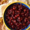 Rum Raisin Whole Berry Cranberry Sauce - This homemade whole berry cranberry sauce is the perfect holiday side dish. Made with fresh cranberries, golden raisins, spiced rum, granulated sugar, light brown sugar, and a touch of cinnamon, sea salt, and vanilla, this rum-raisin-flavored cranberry sauce adds a special touch to any holiday meal. The tartness of the cranberries, the sweetness of the sugars, and the spiciness of the rum all come together to make a delicious and unique cranberry sauce that will be a hit with your holiday guests.