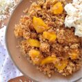 Unsweetened Coconut Oatmeal Peach Crisp - You just can't beat a warm, comforting, bubbly oatmeal peach crisp fresh out of the oven, especially if it's topped with a crunchy buttery topping made with quick-cooking oats, unsweetened shredded coconut, brown sugar, cinnamon, melted butter, and vanilla. And, since you can use either fresh or frozen peaches for this fruity dessert, this is one simple and easy recipe that you'll be able to enjoy year-round.