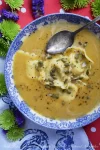 Butternut Squash Soup with Cheese Ravioli - THE BEST Butternut Squash Soup Recipes - Is there anything better than coming inside from the cold to the smell of a simmering pot of butternut squash soup on the stove? Whether you're craving a hearty, chunky version packed with earthy goodness or you're longing for a velvety, smooth bowl of soup, destined to be paired with a perfectly gooey grilled cheese, we've got you covered. In this recipe round-up, you'll find the best butternut squash soup recipes, guaranteed to chase away the chill, while filling your home with an irresistible aroma this fall and winter.
