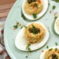 Deviled Eggs with Lemon Caper Remoulade - These flavorful deviled eggs take things to the next level with a zesty, homemade lemon caper remoulade. With a bright punch of lemon zest and the perfect salty bite of capers, these appetizer cuties are about to become the star of every backyard barbecue. And, thanks to a touch of heat, these deviled eggs are anything but ordinary. Finished with a dusting of paprika, a garden-fresh garnish of chives, and a few whole non-pareil capers, these lil' bites are guaranteed to disappear practically the moment you set them down.