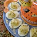 Deviled Eggs with Basil Pumpkin Seed Pesto - Imagine a deviled egg filling that is impossibly creamy, brightened up with a burst of fresh basil and lemon, and finished with the satisfying, earthy crunch of roasted salted pepitas. It’s a texture lover’s dream. Topped with a sprinkle of finely ground black pepper and crumbled shaved Parmesan cheese, this deviled egg recipe strikes the perfect balance of creamy, salty, nutty, tangy flavor. Sophisticated enough for a holiday appetizer but simple enough for a Tuesday night craving, these Deviled Eggs with Basil Pumpkin Seed Pesto are the year-round staple your recipe box has been missing.